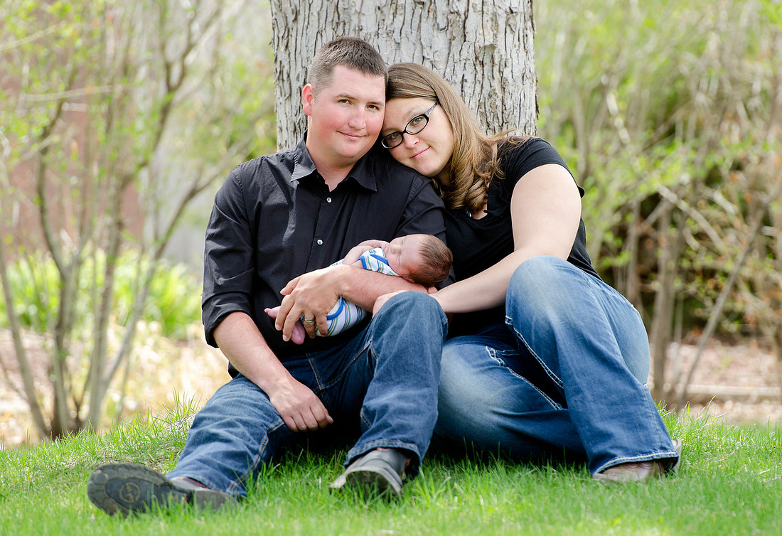 Outdoors family portrait with new baby Porter